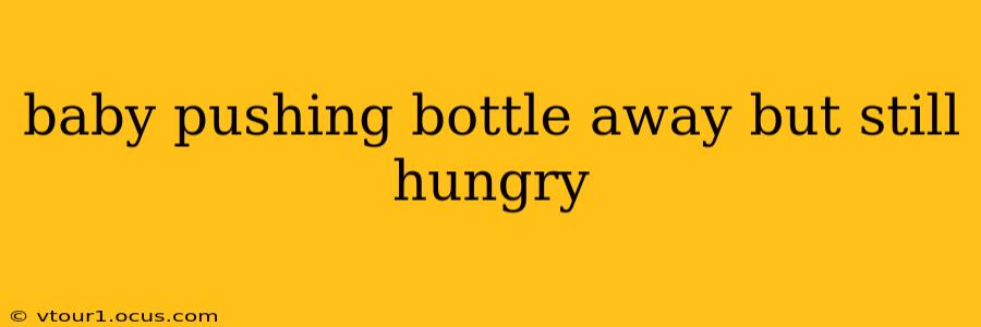 baby pushing bottle away but still hungry