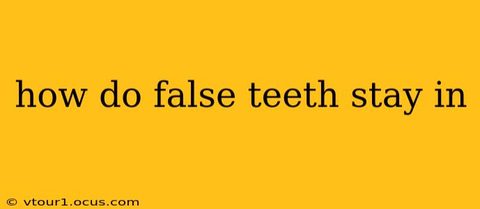 how do false teeth stay in